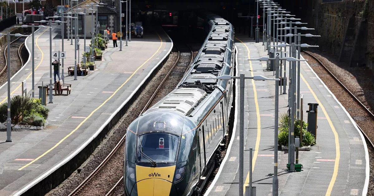 A Great Western Railway (GWR) Hitachi train waits at Penzance station